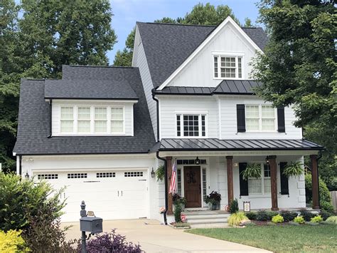 metal houses with brick|white house black metal roof.